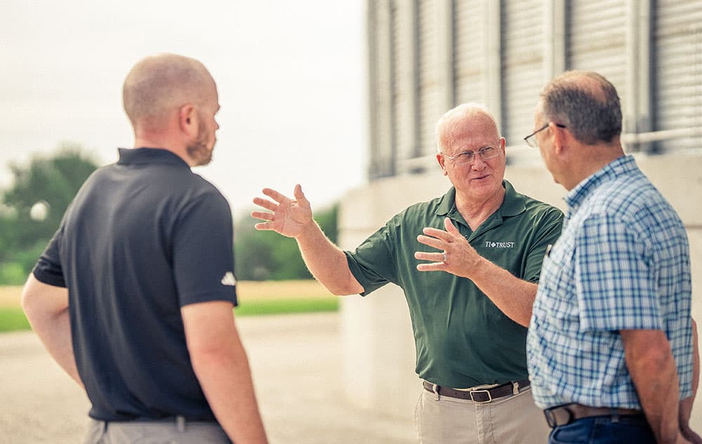 Trust-Farm-Services Farm Services Team chatting on the farm